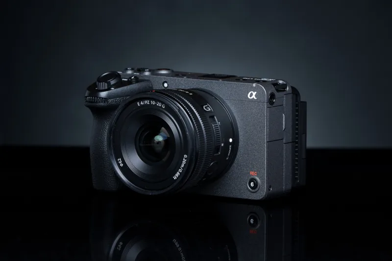 Sony FX30 with a Sony E 10–20mm F4 PZ G lens on a dark reflective surface