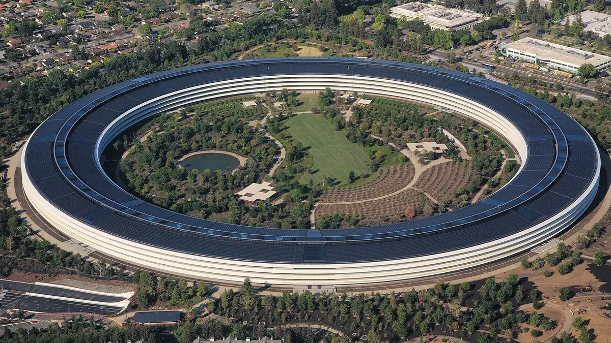 Aerial view of the ring-shaped Apple Park campus and its central gardens in Cupertino.