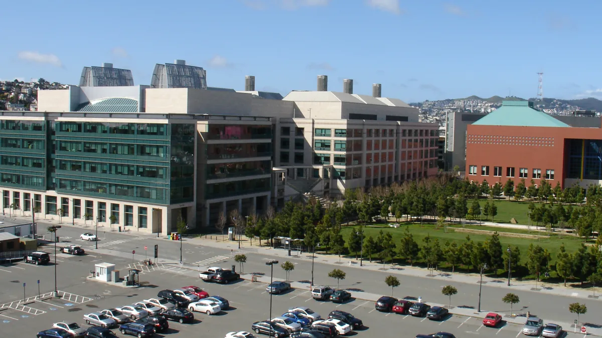 UCSF Mission Bay research buildings overlook a green courtyard and a street in an archive photograph.