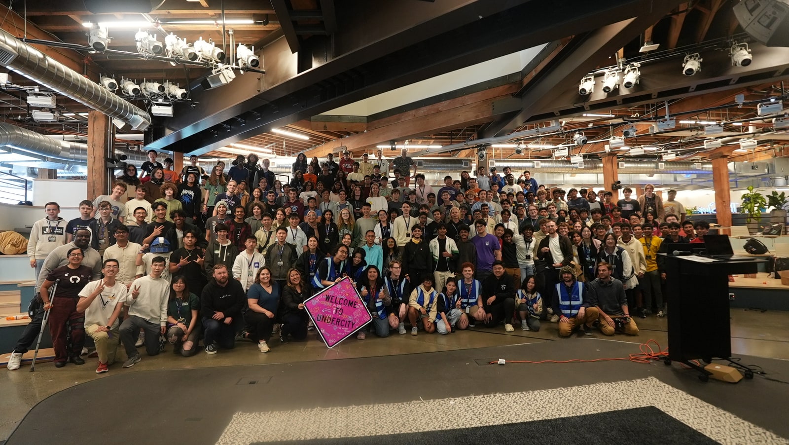 Archive photograph of participants at the Undercity hackathon at GitHub headquarters in July 2025; not a Teams or Copilot demonstration.
