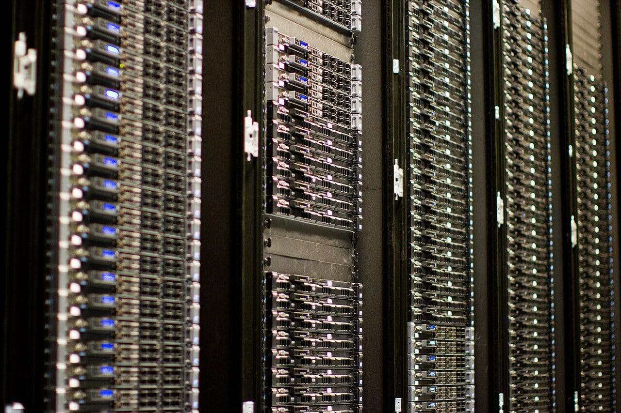 An archive photograph of Wikimedia Foundation server equipment with illuminated status lights.
