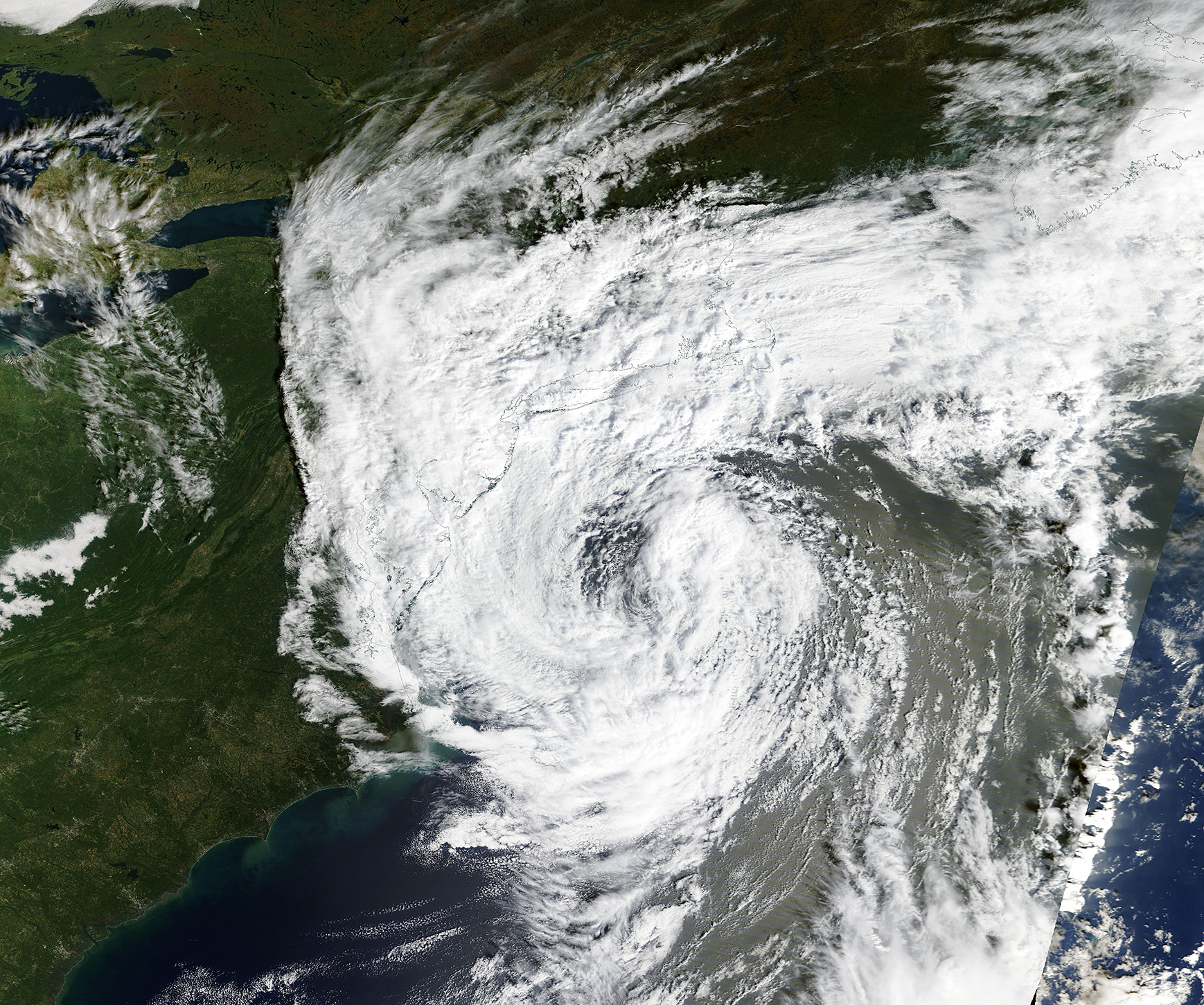 A broad spiral-shaped cloud system over the Atlantic beside the eastern United States, observed by Terra/MODIS on September 26, 2026.