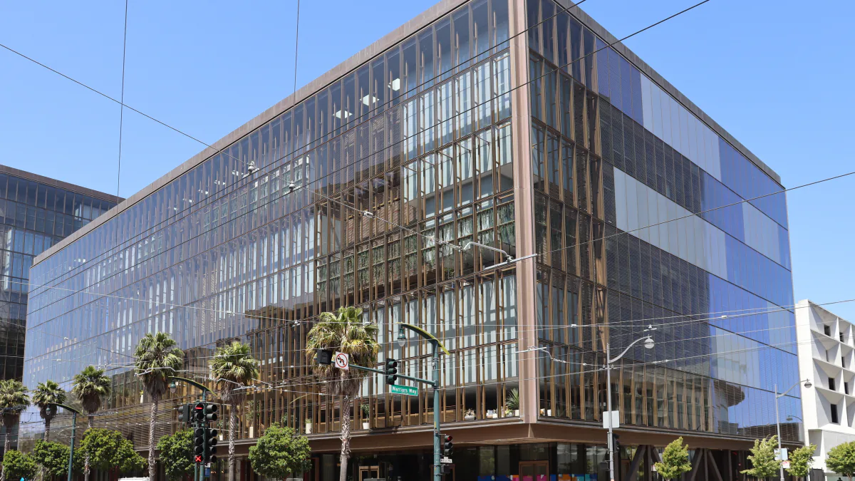 The office building at 1515 Third Street in San Francisco under a clear blue sky.
